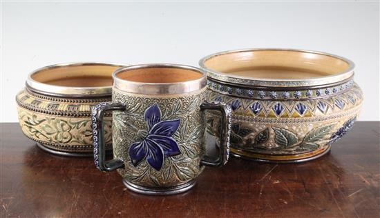 A Doulton Lambeth silver-mounted loving cup by Louisa J Davies and two similar fruit bowls, one by Louisa E. Edwards loving cup height